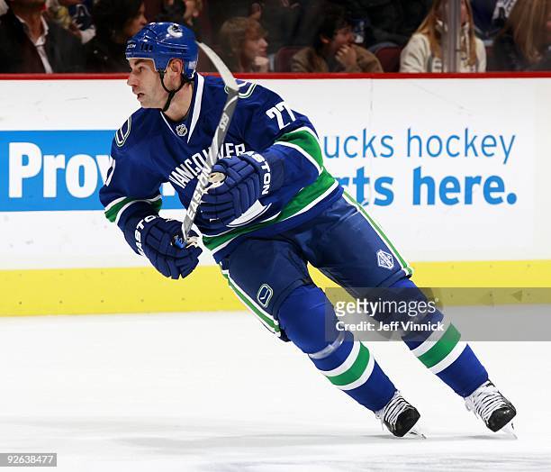 Mathieu Schneider of the Vancouver Canucks skates up ice during their game against the Edmonton Oilers at General Motors Place on October 25, 2009 in...
