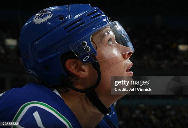 Mason Raymond of the Vancouver Canucks looks on from the bench during their game against the Edmonton Oilers at General Motors Place on October 25,...