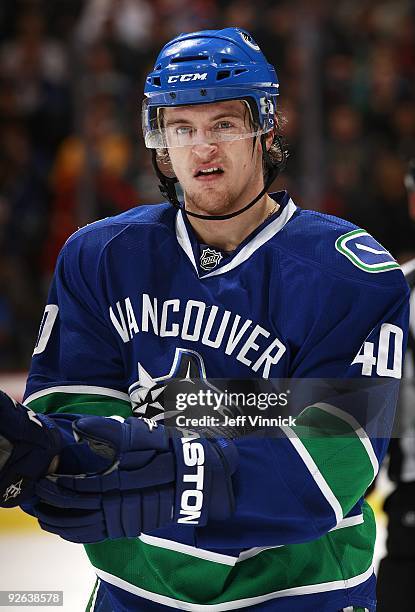 Michael Grabner of the Vancouver Canucks looks on from the bench during their game against the Edmonton Oilers at General Motors Place on October 25,...