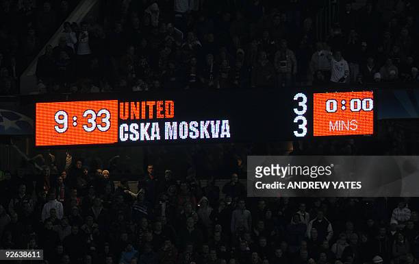 The scoreboard shows the result after Manchester United recovered to draw against CSKA Moscow during their UEFA Champions League Group B football...