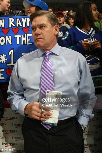 Assistant coach Ryan Walter of the Vancouver Canucks looks on from the bench during their game against the Edmonton Oilers at General Motors Place on...