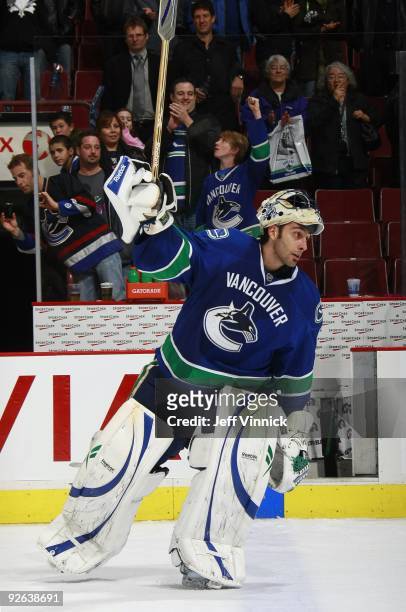 Roberto Luongo of the Vancouver Canucks waves to fans during their game against the Edmonton Oilers at General Motors Place on October 25, 2009 in...