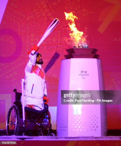 Ali Jawad lights the Paralympic flame during the Paralympic Heritage Flame Lighting Ceremony ahead of the PyeongChang 2018 Winter Paralympic Games,...