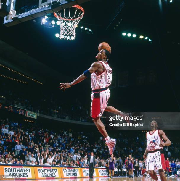 Steve Francis of the Houston Rockets dunks during a game played circa 2001 at the Compaq Center in Houston, Texas. NOTE TO USER: User expressly...