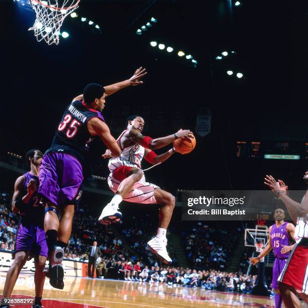 Steve Francis of the Houston Rockets shoots during a game played circa 2001 at the Compaq Center in Houston, Texas. NOTE TO USER: User expressly...
