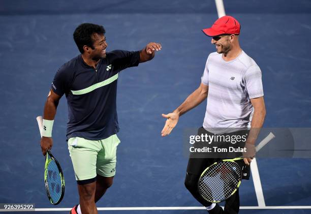 Jamie Cerretani of United States and Leander Paes of India celebrate a point during their semi final match against Damir Dzumhur of Bosnia and...