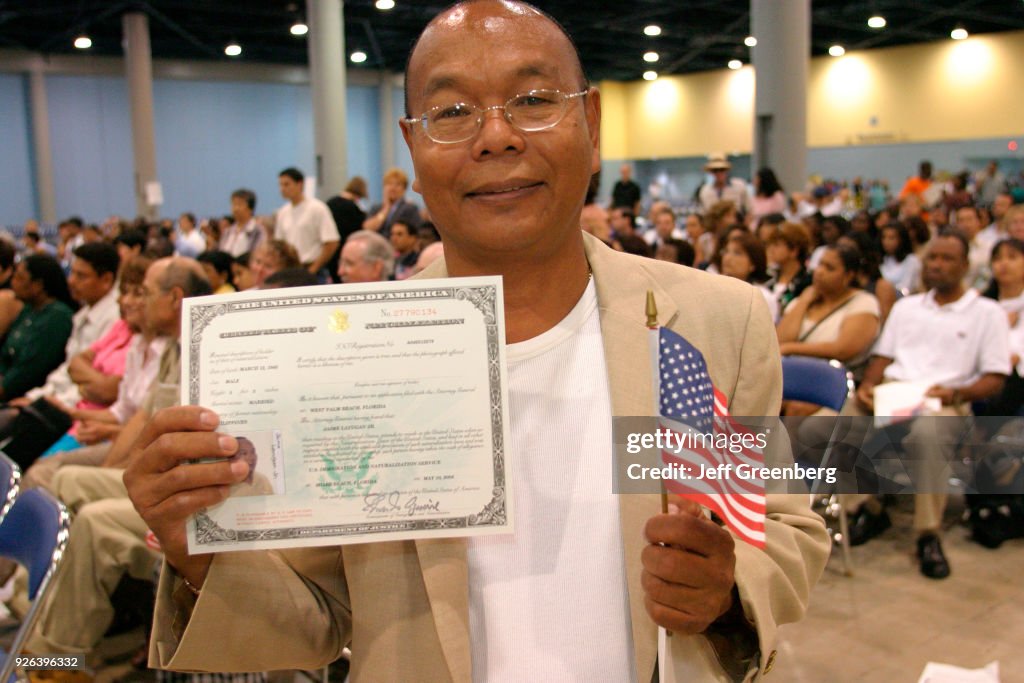 Naturalization Rights A man with a Certificate of Naturalization at the naturalization ...