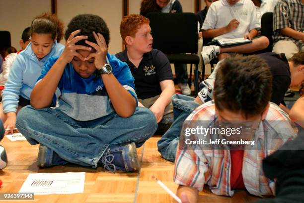 Elementary school students competing in the Miami-Dade & Monroe County Spelling Bee with word games during a break at Florida International...