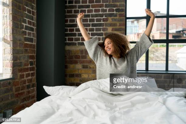 black woman waking up in the morning - duvet stock pictures, royalty-free photos & images