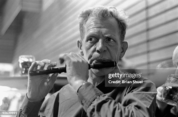 Photo of John DOONAN, John Doonan playing his piccolo at the Keele Folk Festival