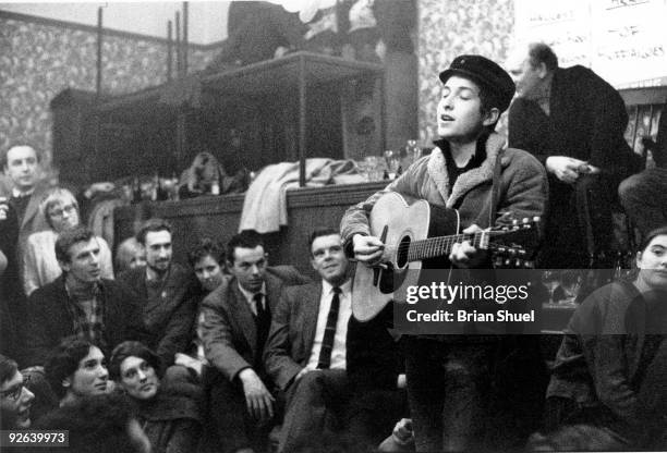 American folk singer-songwriter, Bob Dylan, performing live onstage at the Singers Club Christmas party on his first visit to Britain, December 22,...