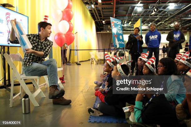 Actor Justin Long reads to elementary school children from the Garden of Dreams Foundation during Read Across America Day Celebrates Dr. Seuss'...