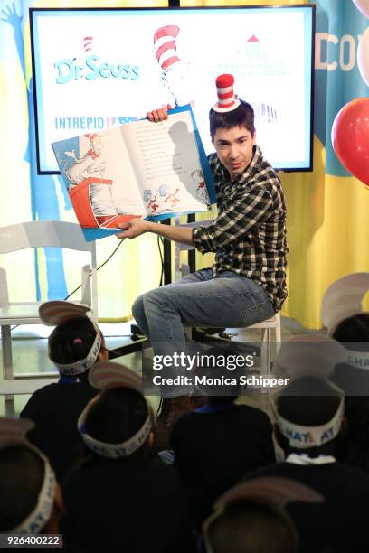 Actor Justin Long reads to elementary school children from the Garden of Dreams Foundation during Read Across America Day Celebrates Dr. Seuss'...