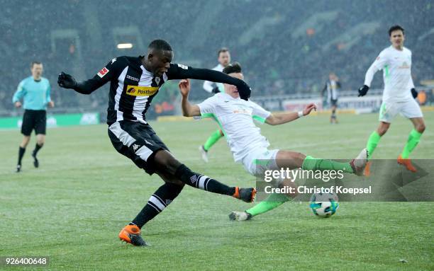 Denis Zakaria of Moenchengladbach scores the second goal against Marco Friedl of Bremen during the Bundesliga match between Borussia Moenchengladbach...