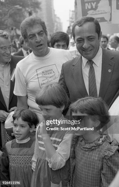 New York - Governor Mario Cuomo poses for pictures with a group of children on the streets of New York City. Governor Cuomo is pushing the Bond...
