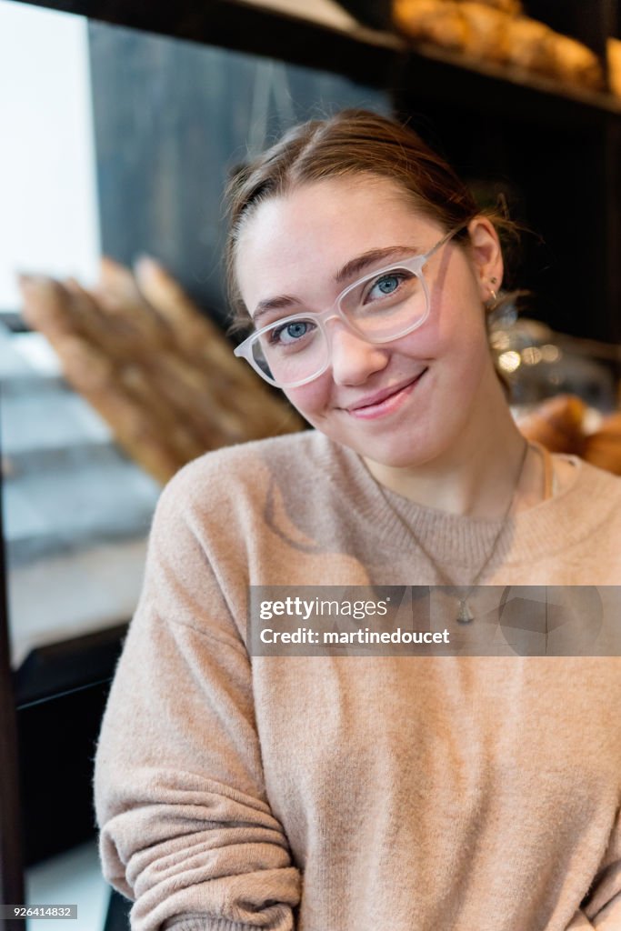 Portrait of young woman in a local coffee shop.