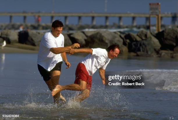 Casual portrait of Jacksonville Jaguars Tony Boselli with his fasther, Tony Sr., during photo shoot on beach. Newport Beach, CA 6/20/1995 CREDIT:...