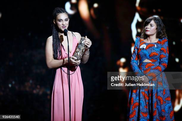 Camelia Jordana poses with the best newcomer female actor Award for the movie "Le Brio", given by Blanche Gardin during the Cesar Film Awards 2018 at...