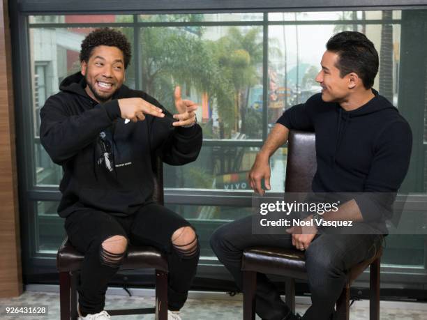 Jussie Smollett and Mario Lopez visit "Extra" at Universal Studios Hollywood on March 2, 2018 in Universal City, California.