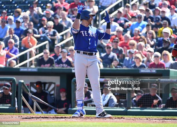 Joey Gallo of the Texas Rangers reacts after a third strike call during the first inning of a spring training game against the Cleveland Indians at...