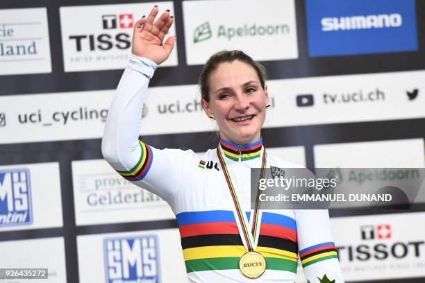 Gold medalist Germany's Kristina Vogel celebrates on the podium after taking part in the women's sprint final during the UCI Track Cycling World...