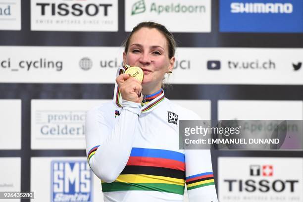 Gold medalist Germany's Kristina Vogel celebrates on the podium after taking part in the women's sprint final during the UCI Track Cycling World...