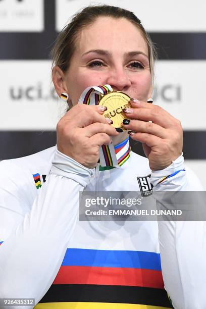 Gold medalist Germany's Kristina Vogel celebrates on the podium after taking part in the women's sprint final during the UCI Track Cycling World...