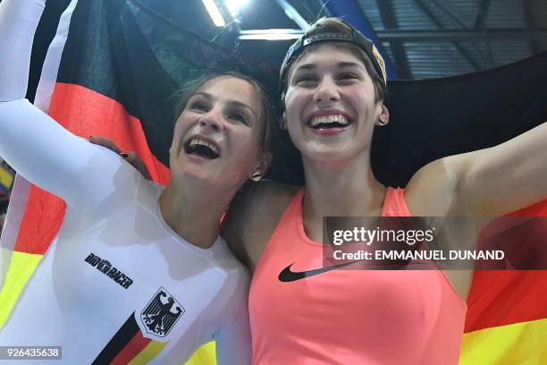 Gold medalist Germany's Kristina Vogel and Bronze medalist Germany's Pauline Sophie Grabosch celebrate after women's sprint final during the UCI...