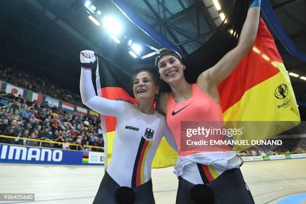 Gold medalist Germany's Kristina Vogel and Bronze medalist Germany's Pauline Sophie Grabosch celebrate after women's sprint final during the UCI...