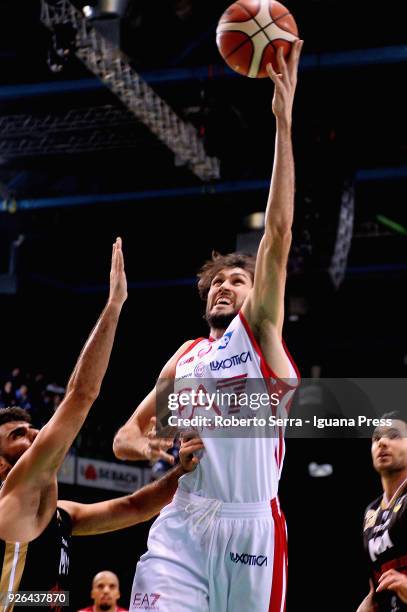Davide Pascolo of EA7 competes with Salvatore Parrillo and Christian Burns of MIA during the match quarter final of Coppa Italia between Olimpia EA7...