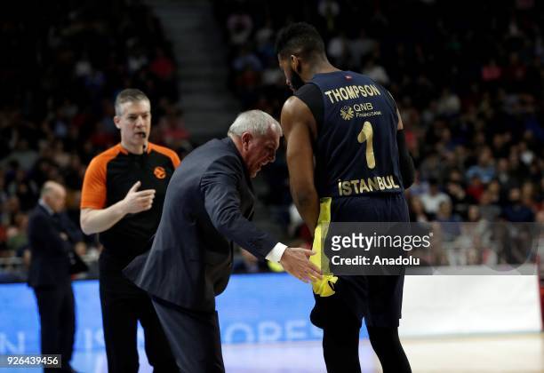 Head coach of Fenerbahce Dogus Zeljko Obradovic talks with his player Jason Thompson during the Turkish Airlines Euroleague basketball match between...