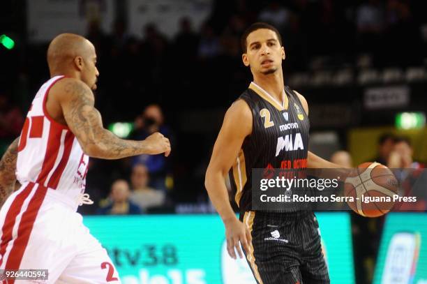 Jaime Smith of MIA competes with Jordan Theodore of EA7 during the match quarter final of Coppa Italia between Olimpia EA7 Armani Milano and Mia Red...