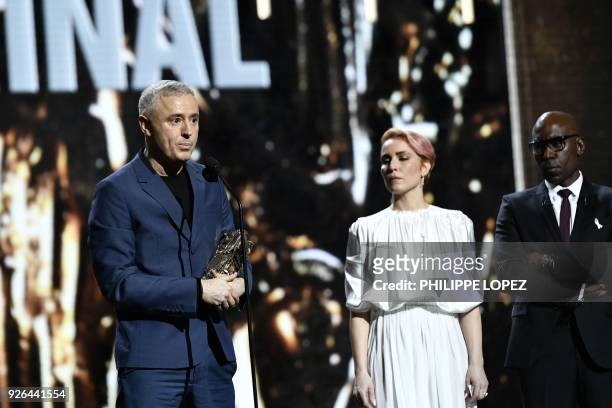 French screenwriter and film director Robin Campillo delivers a speech after winning the Best Original Screenplay award for the film "120 battements...
