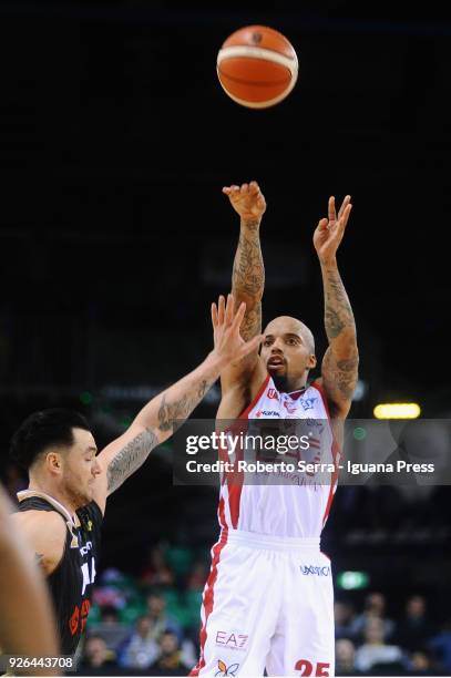 Jordan Theodore of EA7 competes with Christian Burns of MIA during the match quarter final of Coppa Italia between Olimpia EA7 Armani Milano and Mia...