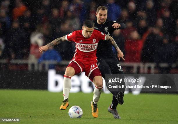 Middlesbrough's Muhamed Besic and Leeds United's Kemar Roofe battle for the ball during the Sky Bet Championship match at the Riverside Stadium,...