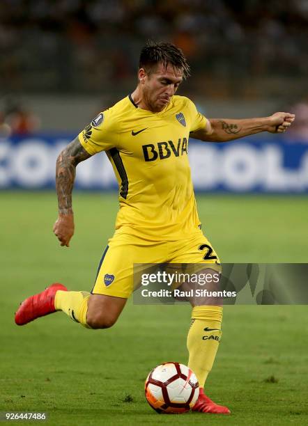 Julio Buffarini of Boca Juniors kicks the ball during a groups stage match between Alianza Lima and Boca Juniors as part of Copa Conmebol...
