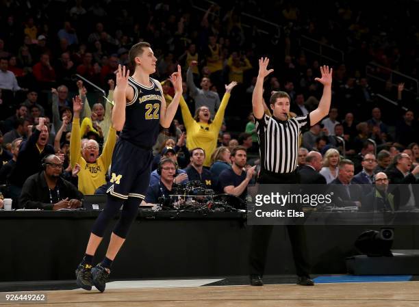 Duncan Robinson of the Michigan Wolverines celebrates his three point shot in the second half against the Nebraska Cornhuskers during quarterfinals...