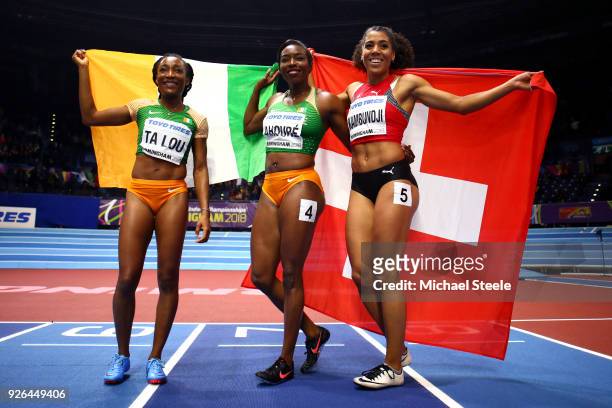 Murielle Ahoure Marie-Josee Ta Lou of Cote D'Ivoire and Mujinga Kambundji of Switzerland celebrates after the 60 Metres Womens Final during the IAAF...