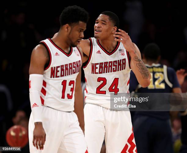 Anton Gill and James Palmer Jr. #24 of the Nebraska Cornhuskers react in the second half against the Michigan Wolverines during quarterfinals of the...