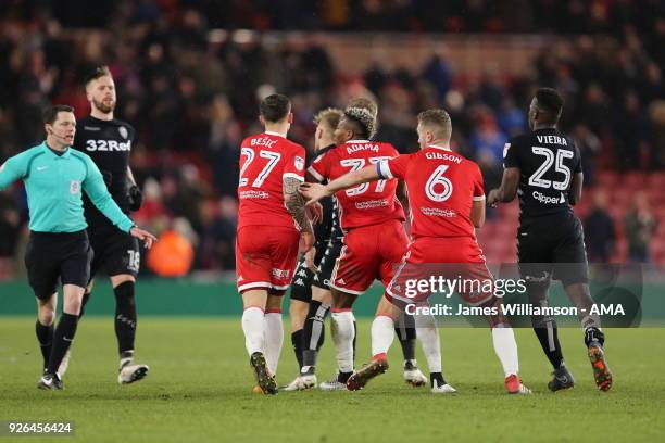 Muhamed Besic of Middlesbrough with Ben Gibson of Middlesbrough after Basic clashes with Samuel Saiz of Leeds United at full time during the Sky Bet...