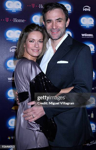 Actress Lisa Martinek and friend Guilio Ricciarelli arrive on the red carpet prior to the GQ Men Of The Year 2009 award ceremony on November 3, 2009...