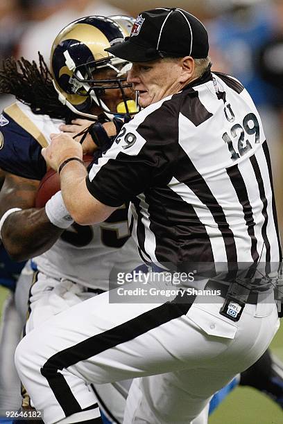 Steven Jackson of the St. Louis Rams collides with umpire Bill Schuster during the game against the Detroit Lions on November 1, 2009 at Ford Field...