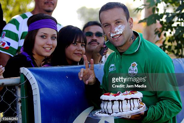 Santos Laguna's Matias Vuoso receives a cakefor his 28th birthday during their training session on November 3, 2009 in Gomez Palacio, Mexico.