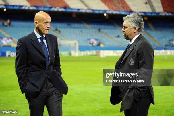 Former Referee Pierluigi Collina of Italy speaks to Chelsea Manager Carlo Ancelotti prior to Champions League Group D match between Atletico Madrid...