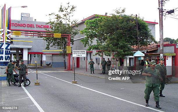 Venezuelan soldiers stand guard at a checkpoint near the Simon Bolivar international bridge in San Antonio, in Venezuela's western state of Tachira,...