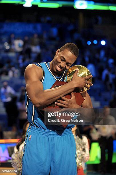 Slam Dunk Contest: Orlando Magic Dwight Howard victorious with trophy after winning competition during All Star Weekend. New Orleans, LA 2/16/2008...