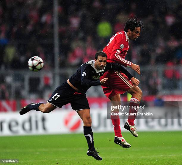 Luca Toni of Bayern is challenged by Marc Planus of Bordeaux during the UEFA Champions League Group A match between FC Bayern Muenchen and Bordeaux...