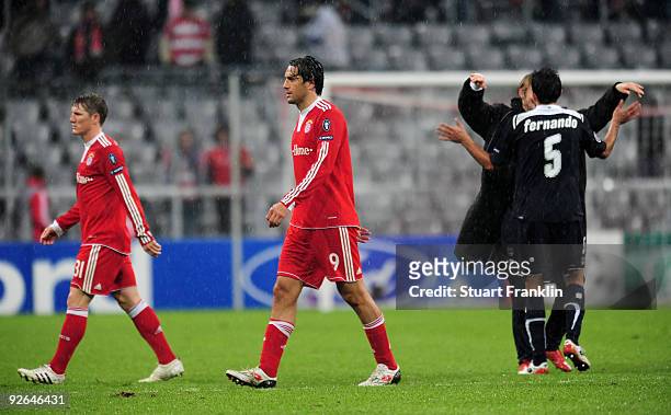 Bastian Schweinsteiger and Luca Toni of Bayern react at the end of the UEFA Champions League Group A match between FC Bayern Muenchen and Bordeaux at...