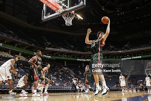 Andrew Bogut of the Milwaukee Bucks rebounds the ball during the preseason game against the Charlotte Bobcats on October 20, 2009 at Time Warner...