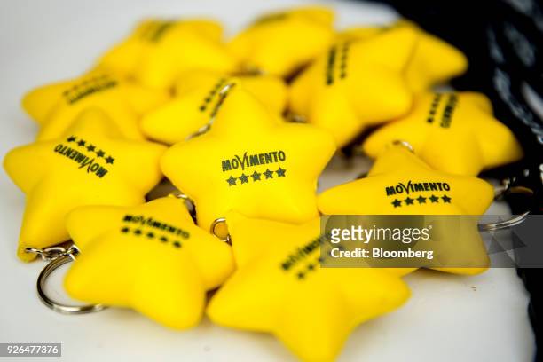 Key rings are displayed for sale before the start of a general election campaign rally for Luigi Di Maio, leader of Italy's anti-establishment Five...